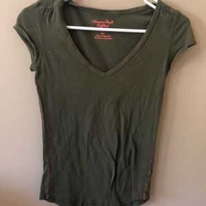 green T-shirt
